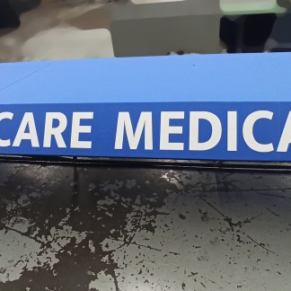 Before — old fabric with faded lettering removed (previous company)