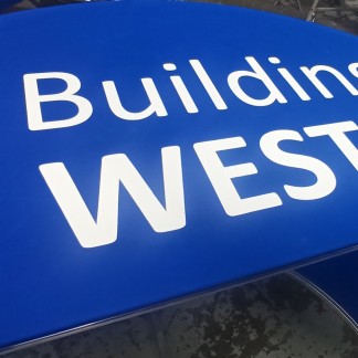 C Building EAST: orange cover; black painted lettering (previous employer)